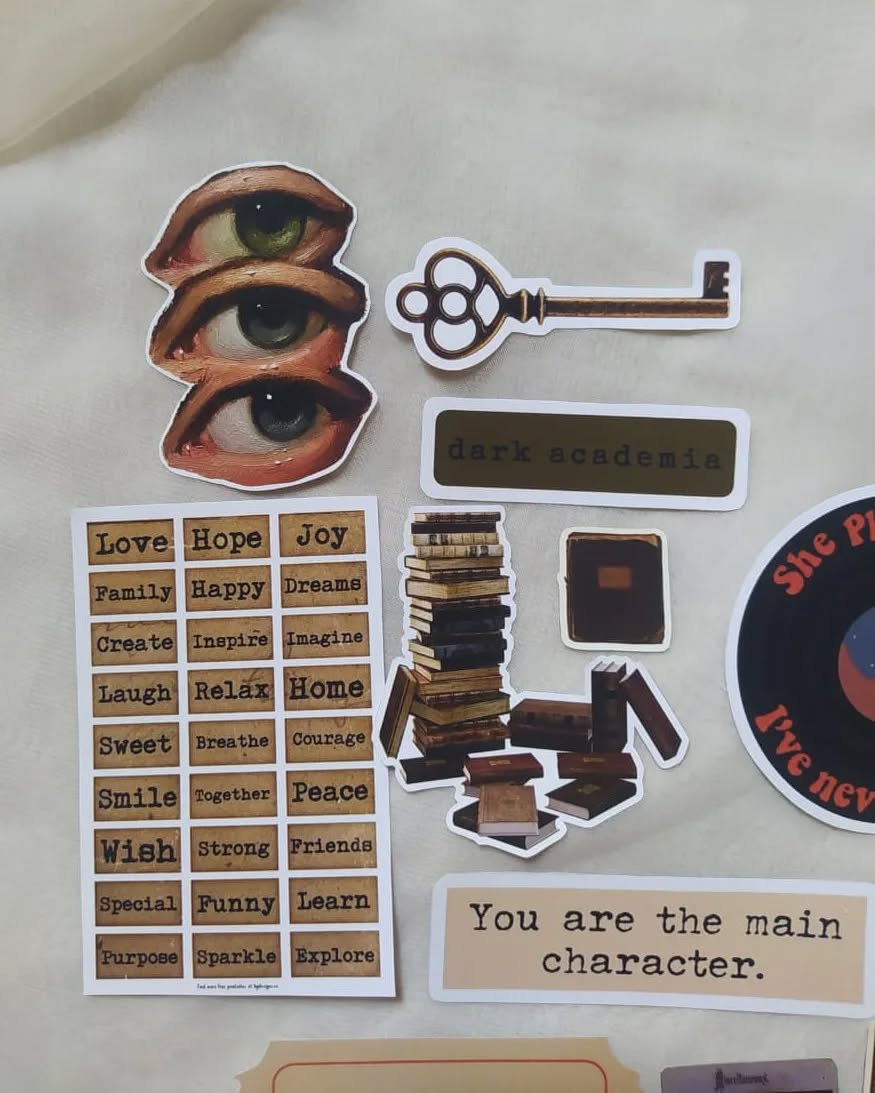 close up of academia stickers with books, notes and vintage elements
